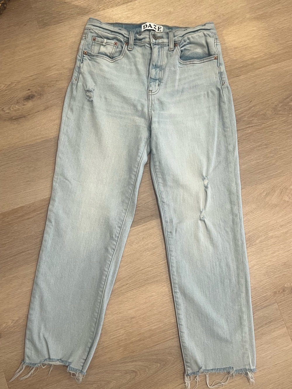 Light Wash Boyfriend Jeans with Raw Hem by DAZE
